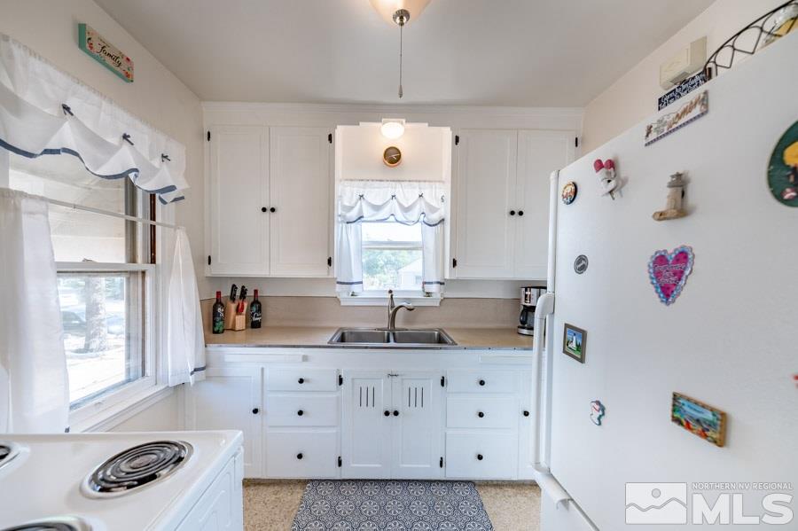 817 Gear Street Reno, NV 89503 - Photo 10 of 21 a bathroom with a double vanity sink mirror and shower
