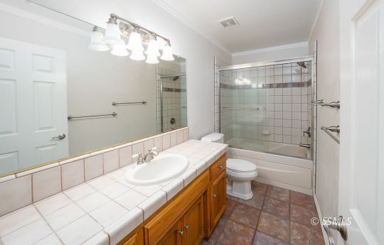 904 North Sol Court Ridgecrest, CA 93555 - Photo 33 of 50 a bathroom with a sink a toilet and shower
