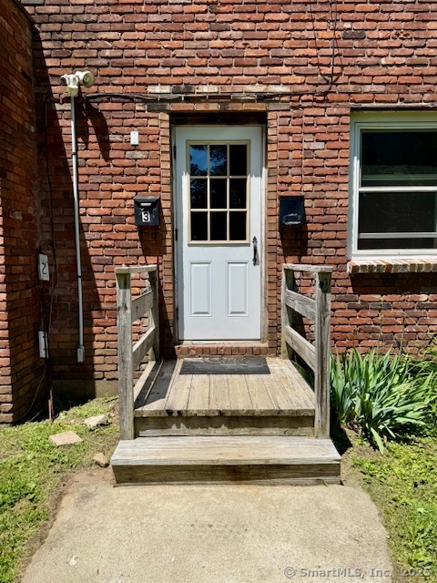 153 Main Street, Unit 2 East Hampton, CT 06424 - Photo 2 of 33 Entrance to the apartment on the right side of the building
