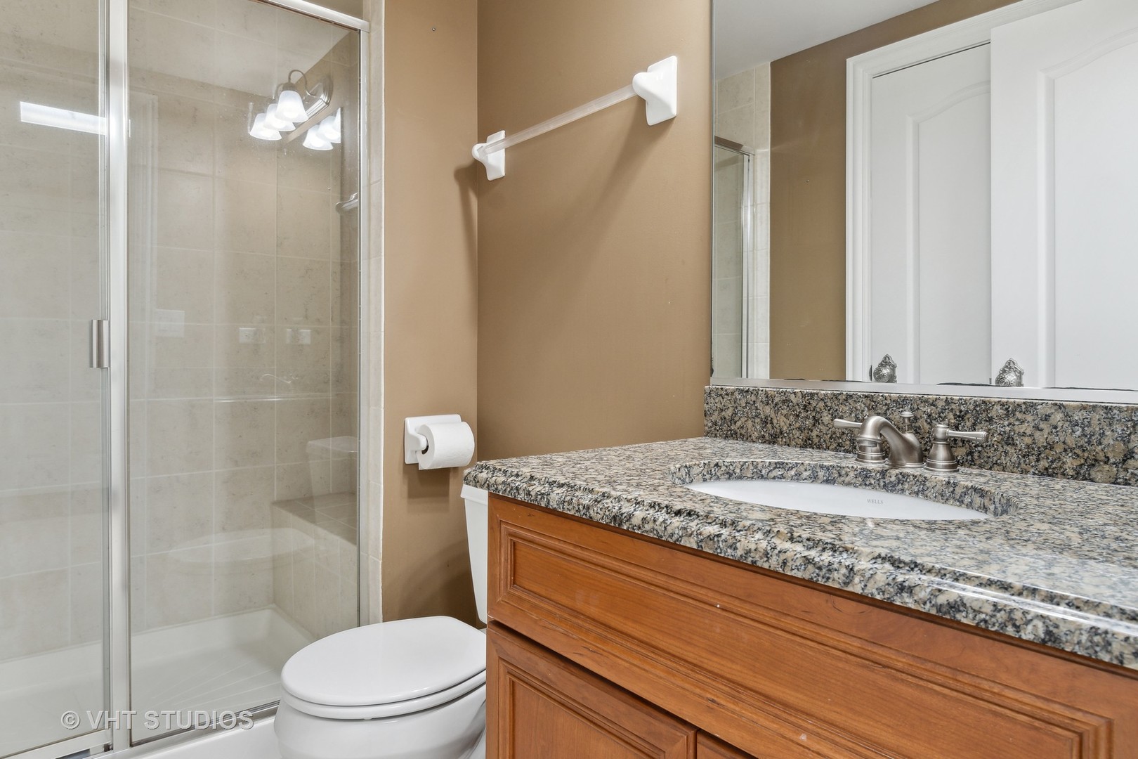 8S287 Hampton Circle Naperville, IL 60540 - Photo 29 of 42 a bathroom with a granite countertop sink a toilet and shower