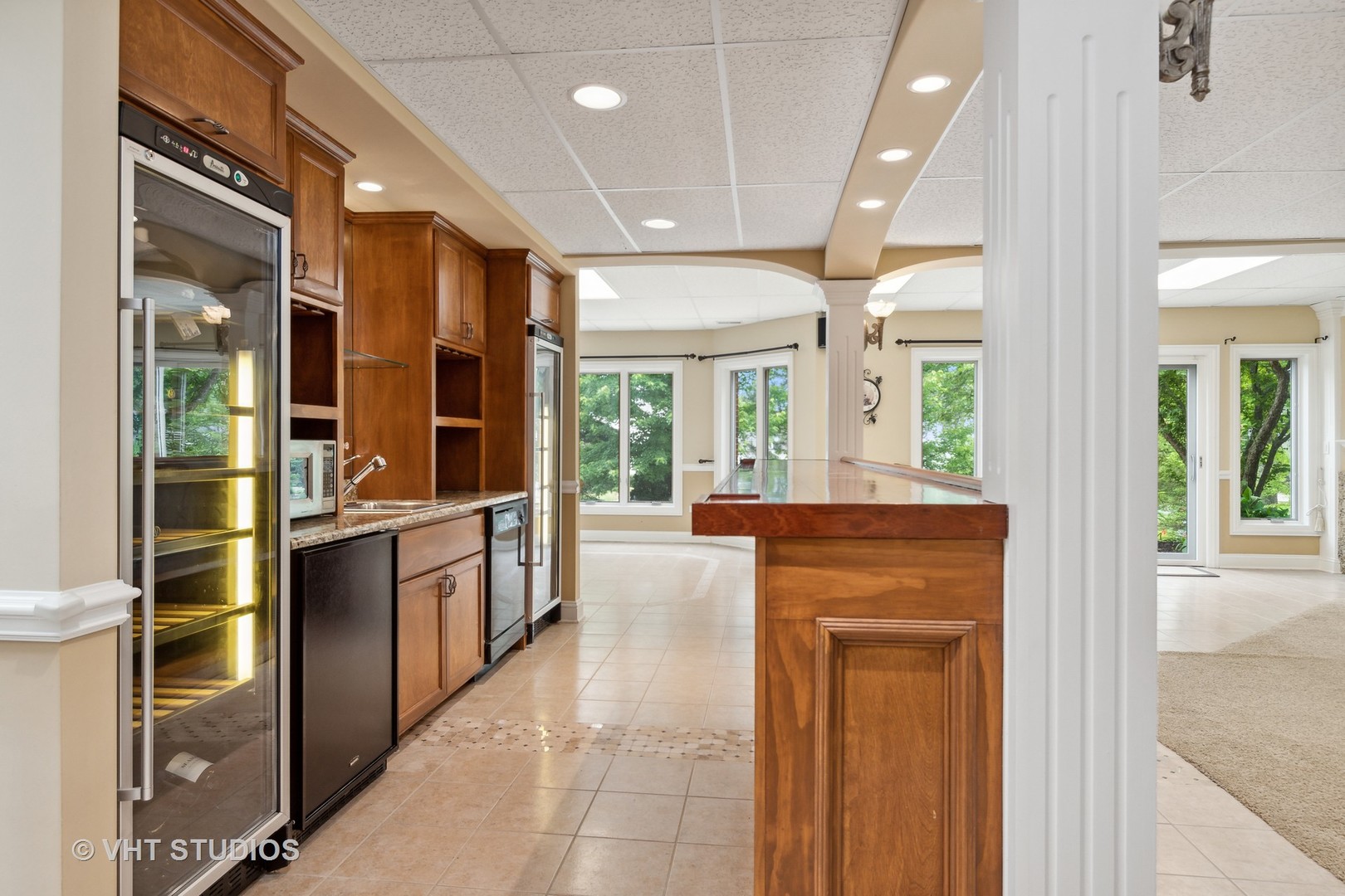 8S287 Hampton Circle Naperville, IL 60540 - Photo 34 of 42 a large kitchen with kitchen island granite countertop a large window and stainless steel appliances