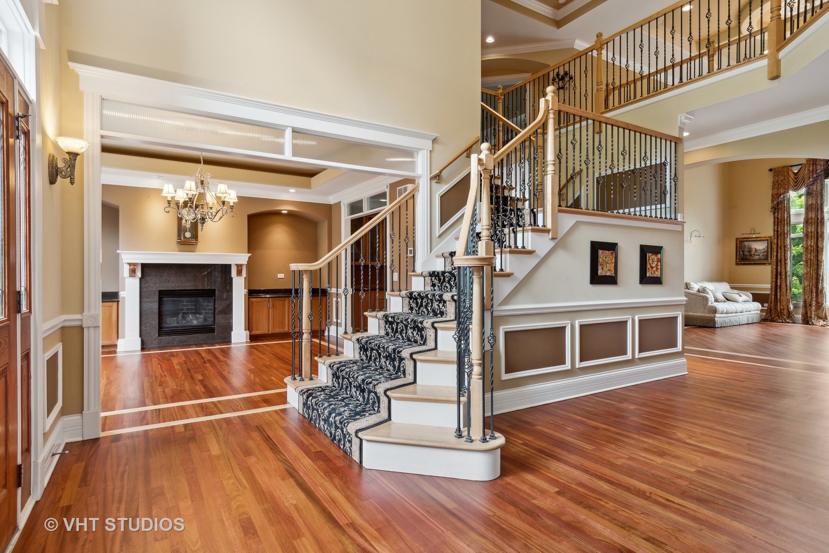 8S287 Hampton Circle Naperville, IL 60540 - Photo 4 of 42 a view of a living room with wooden floor and staircase