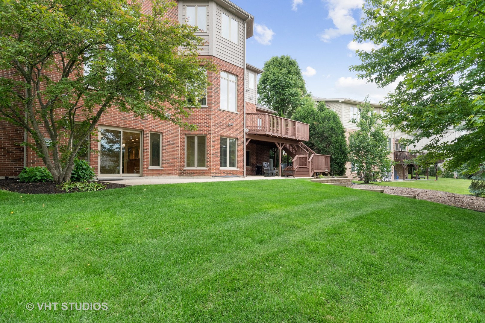 8S287 Hampton Circle Naperville, IL 60540 - Photo 41 of 42 a front view of a house with garden and trees