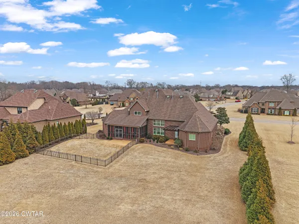 an aerial view of a house with a yard
