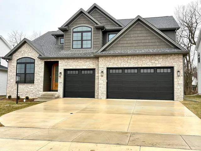 a front view of a house with a garage