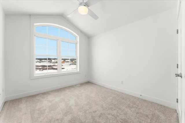 a kitchen with cabinets and window