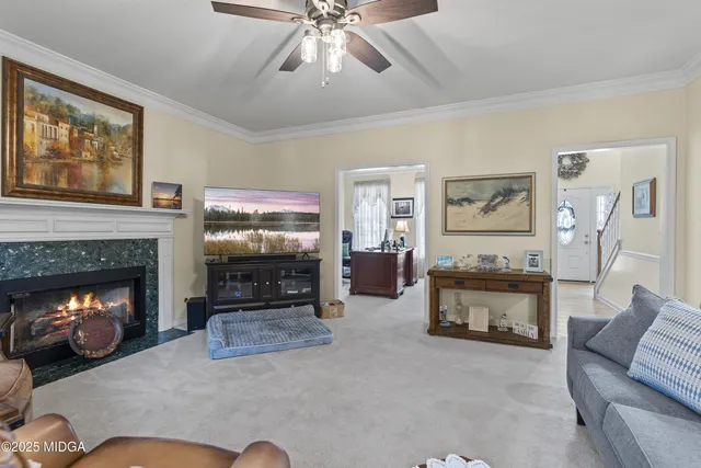 a dining room with wooden floor a chandelier a wooden table and chairs