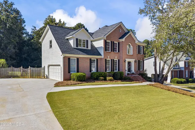 a front view of a house with swimming pool