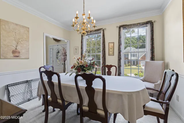 a kitchen with stainless steel appliances granite countertop a refrigerator stove microwave and sink