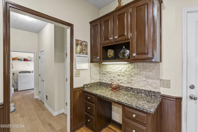 a bedroom with furniture and a bed