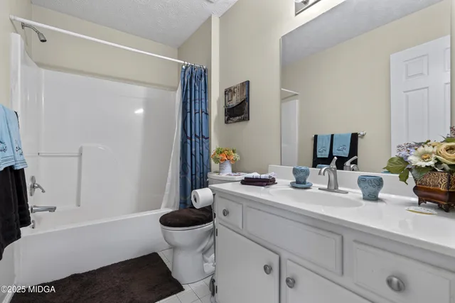 a room with pool table and windows