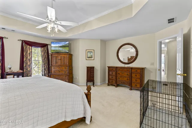 a view of an outdoor sitting area with furniture and umbrella
