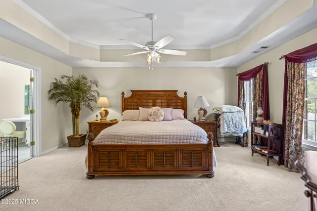 a view of yard with swimming pool and trees in the background