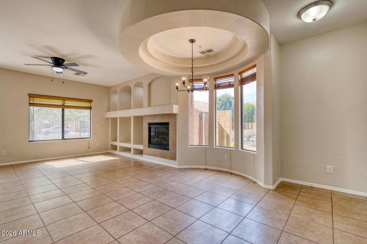 2565 South Signal Butte Road, Unit 46 Mesa, AZ 85209 - Photo 8 of 41 an empty room with windows and fireplace