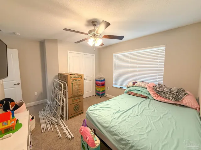 a bed room with a bed and a chandelier