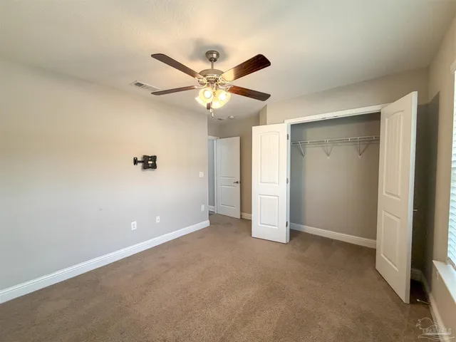 a bathroom with a granite countertop sink toilet a large mirror a bathtub and shower
