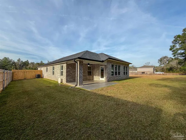 a view of big yard with large trees