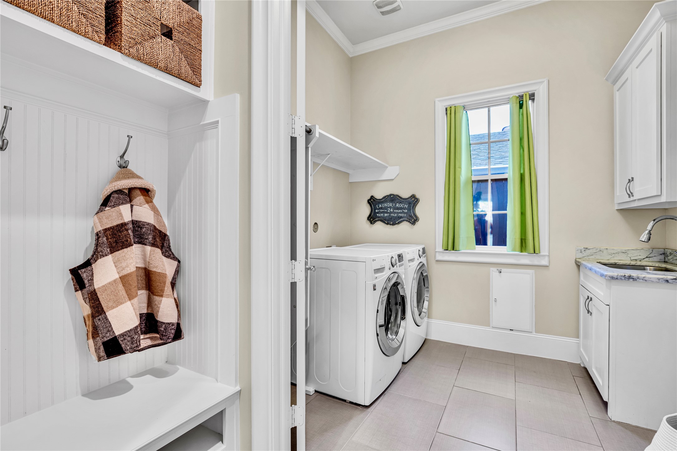 4702 Lido Lane Houston, TX 77092 - Photo 20 of 38 Mud room and laundry with storage and rinse sink has a space for a second refrigerator or freezer AND !! a secret, clever doggie door leading to a fenced dog run