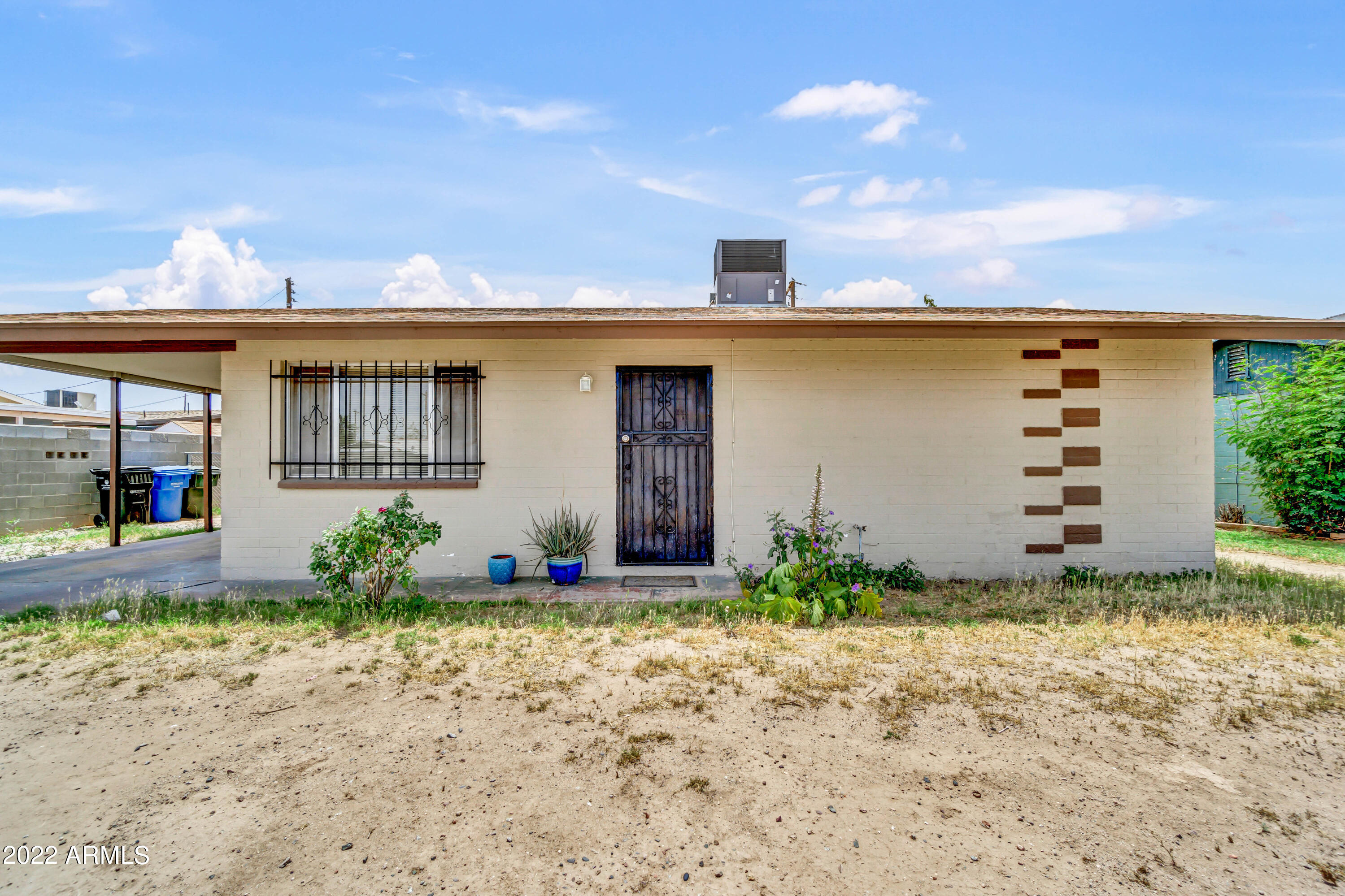 2011 West Pecan Road Phoenix, AZ 85041 - Photo 1 of 25 a front view of a house with garden