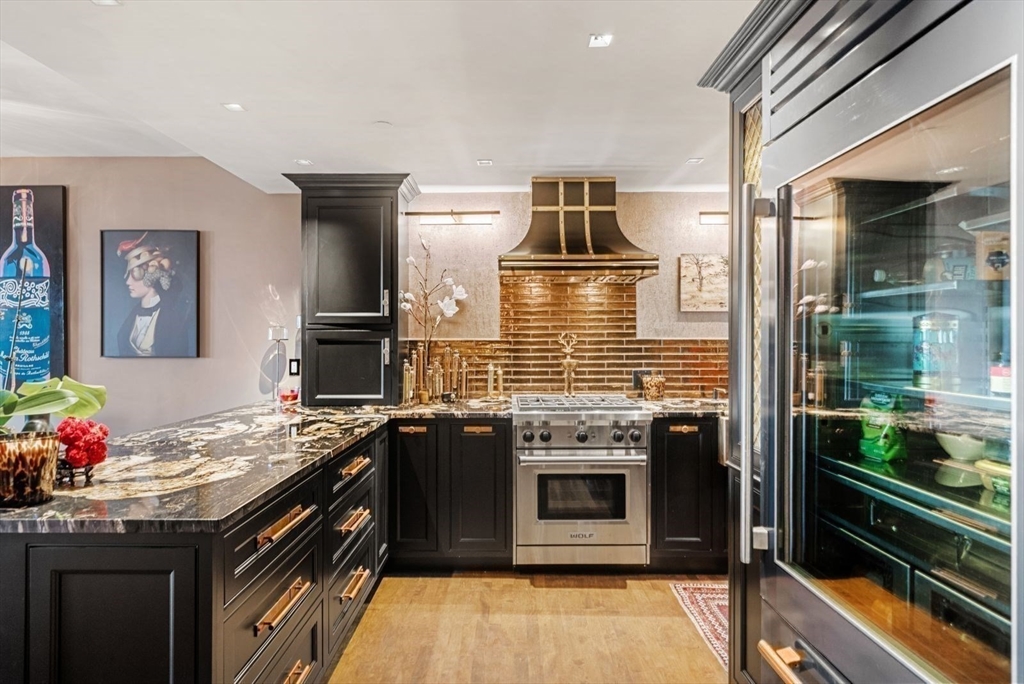 220 Commercial Street, Unit 5A Boston, MA 02109 - Photo 1 of 37 a kitchen with granite countertop a stove and a sink