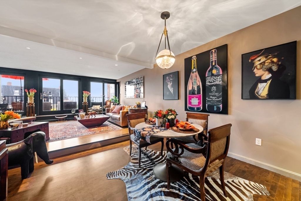 220 Commercial Street, Unit 5A Boston, MA 02109 - Photo 11 of 37 a living room with furniture and a chandelier