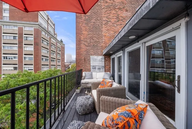 a view of balcony with furniture