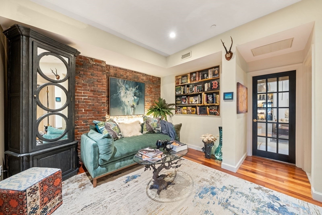 220 Commercial Street, Unit 5A Boston, MA 02109 - Photo 22 of 37 a living room with furniture window and wooden floor