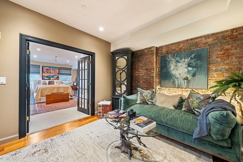 220 Commercial Street, Unit 5A Boston, MA 02109 - Photo 23 of 37 a living room with furniture and a flat screen tv