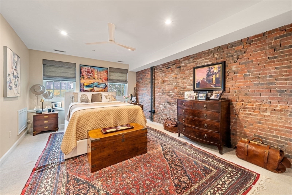 220 Commercial Street, Unit 5A Boston, MA 02109 - Photo 24 of 37 a bedroom with a bed and wooden floor