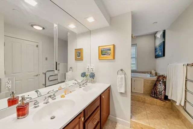 a bathroom with a sink double vanity and a mirror