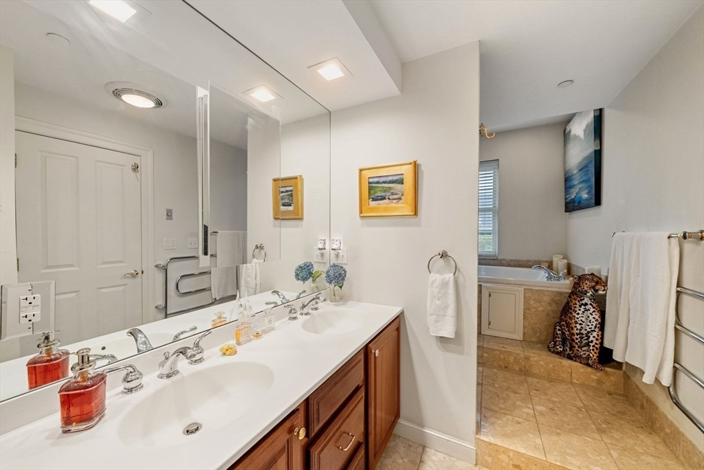 220 Commercial Street, Unit 5A Boston, MA 02109 - Photo 27 of 37 a bathroom with a sink double vanity and a mirror
