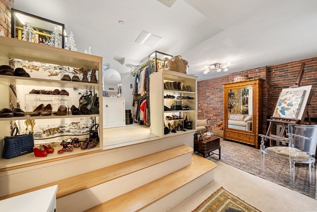 220 Commercial Street, Unit 5A Boston, MA 02109 - Photo 29 of 37 a living room with furniture and a flat screen tv