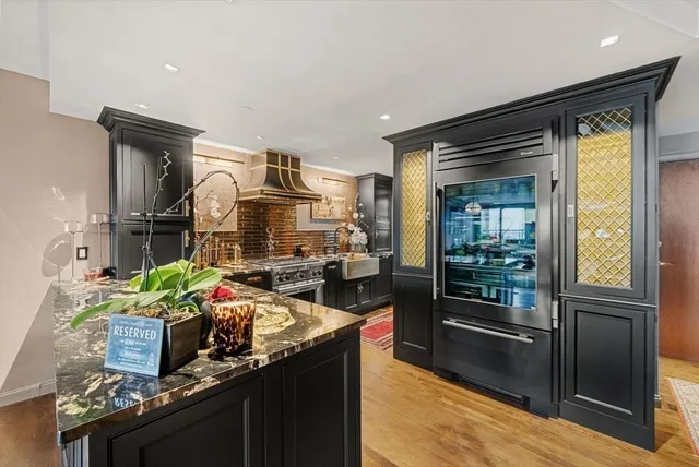 a kitchen with sink refrigerator and stove