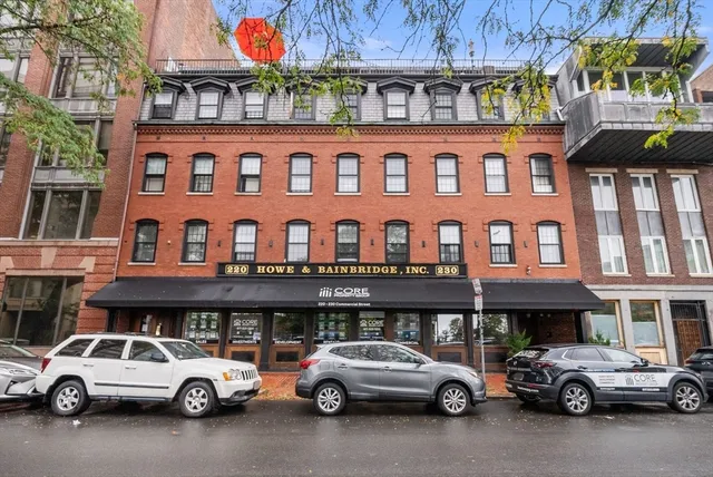 a view of a car parked in front of a building