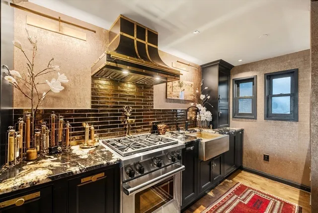 a kitchen with a stove and a sink