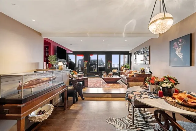 a living room with lots of furniture and a chandelier