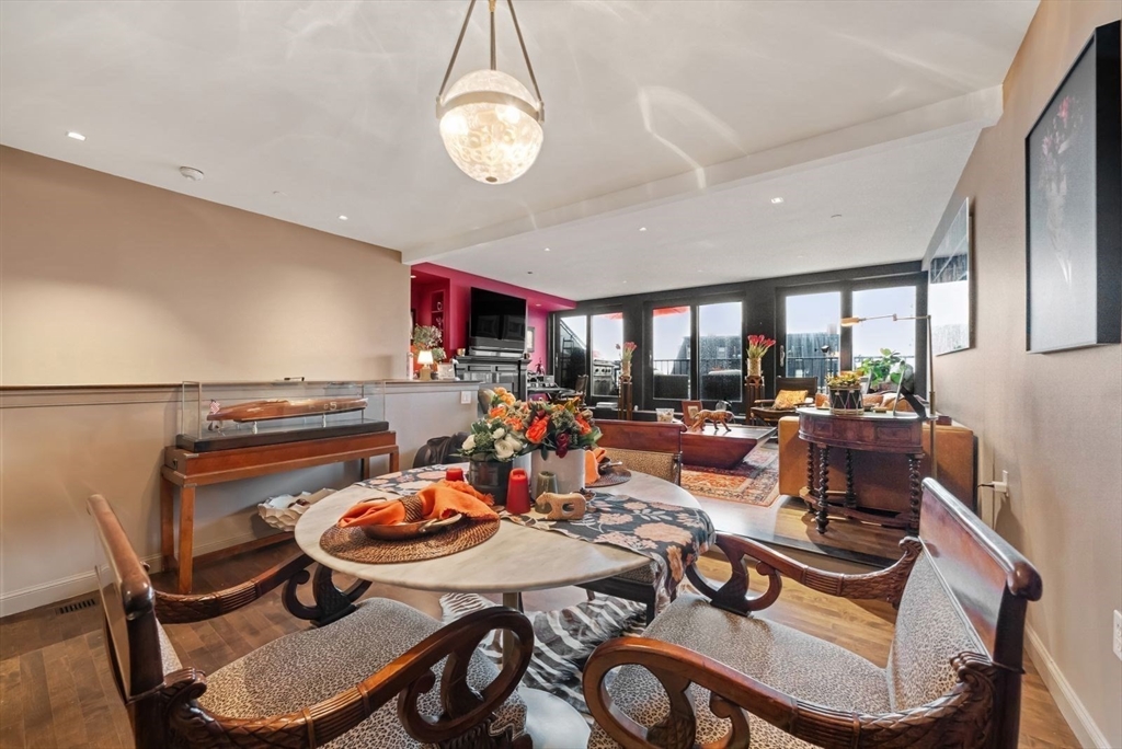 220 Commercial Street, Unit 5A Boston, MA 02109 - Photo 10 of 37 a group of people sitting at a table in a room