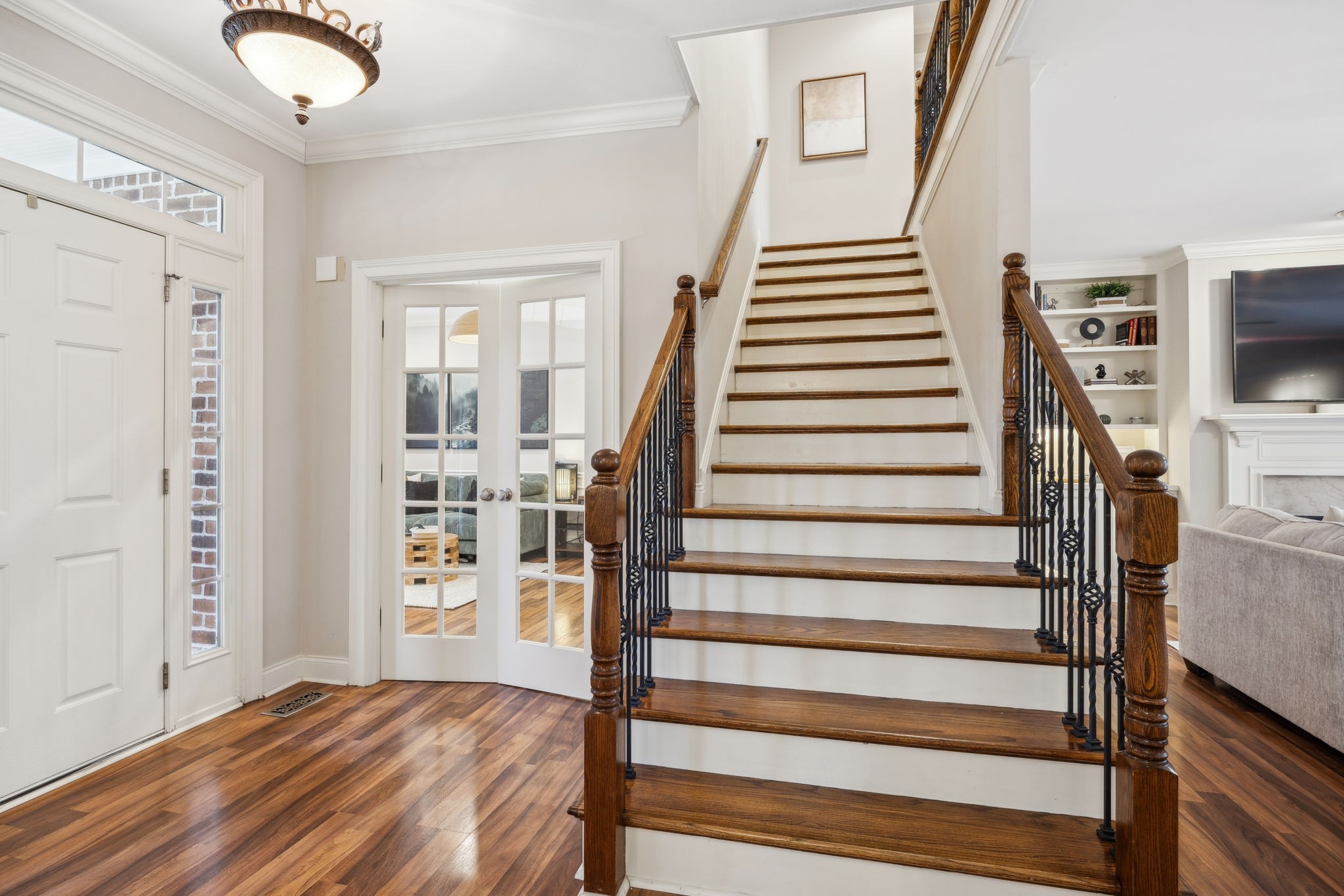 1209 White Rock Road Spring Hill, TN 37174 - Photo 15 of 93 a view of a livingroom with wooden floor and stairs