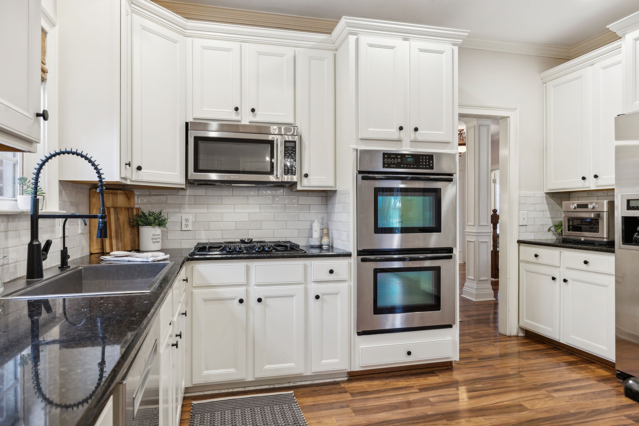 1209 White Rock Road Spring Hill, TN 37174 - Photo 28 of 93 a kitchen with stainless steel appliances granite countertop a stove microwave and refrigerator