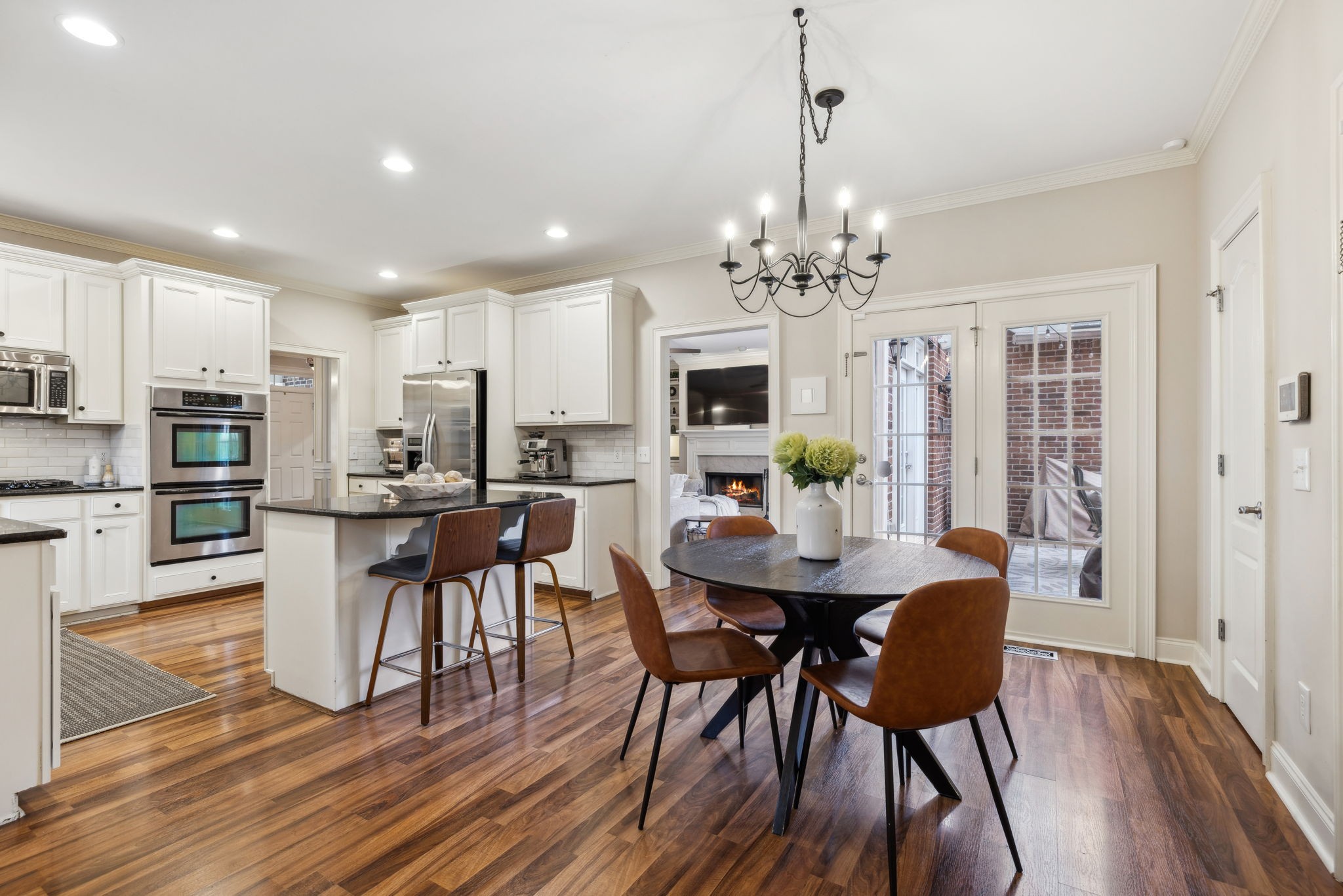 1209 White Rock Road Spring Hill, TN 37174 - Photo 32 of 93 a view of a dining room with furniture a chandelier and wooden floor