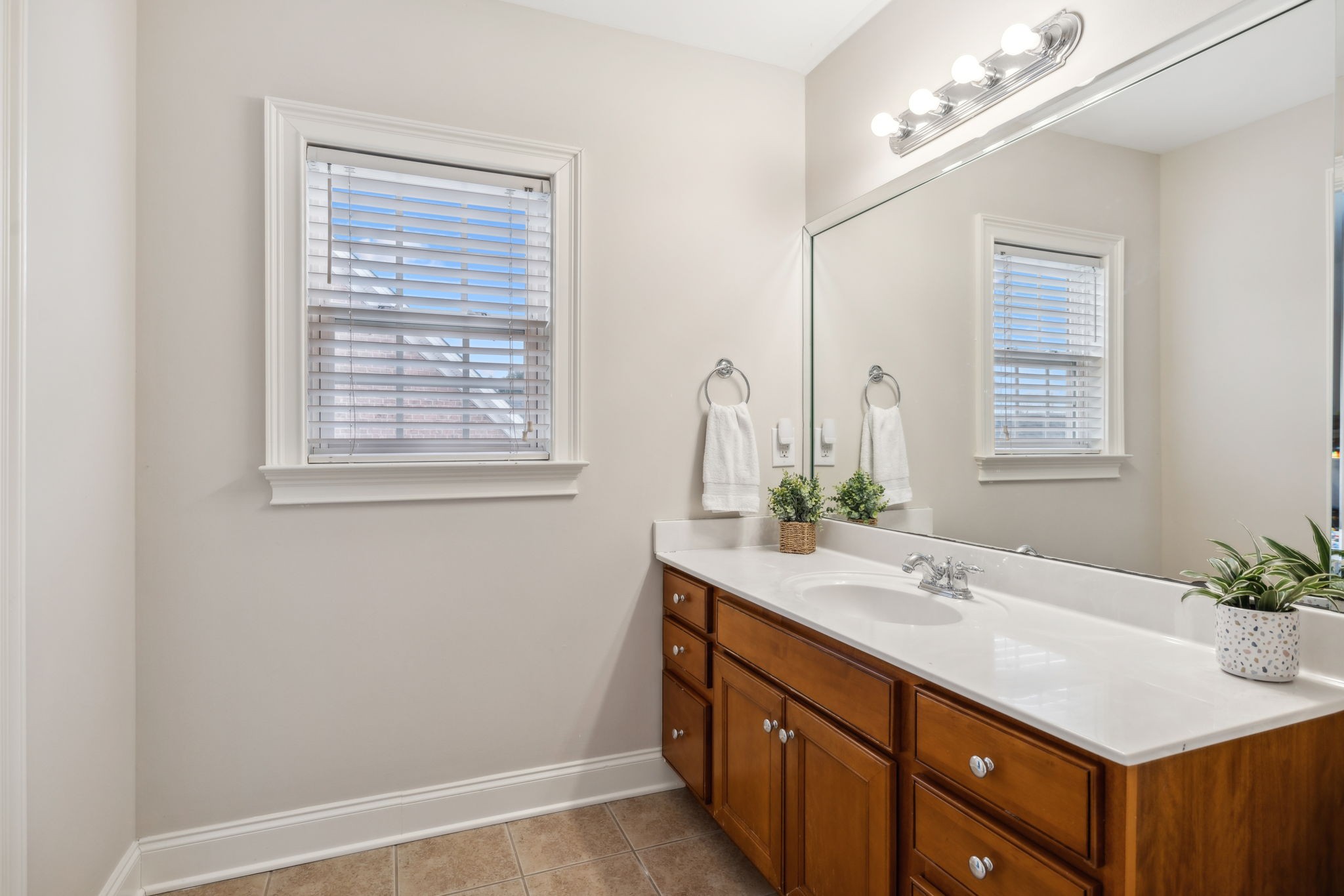 1209 White Rock Road Spring Hill, TN 37174 - Photo 57 of 93 a bathroom with a sink vanity granite and a mirror