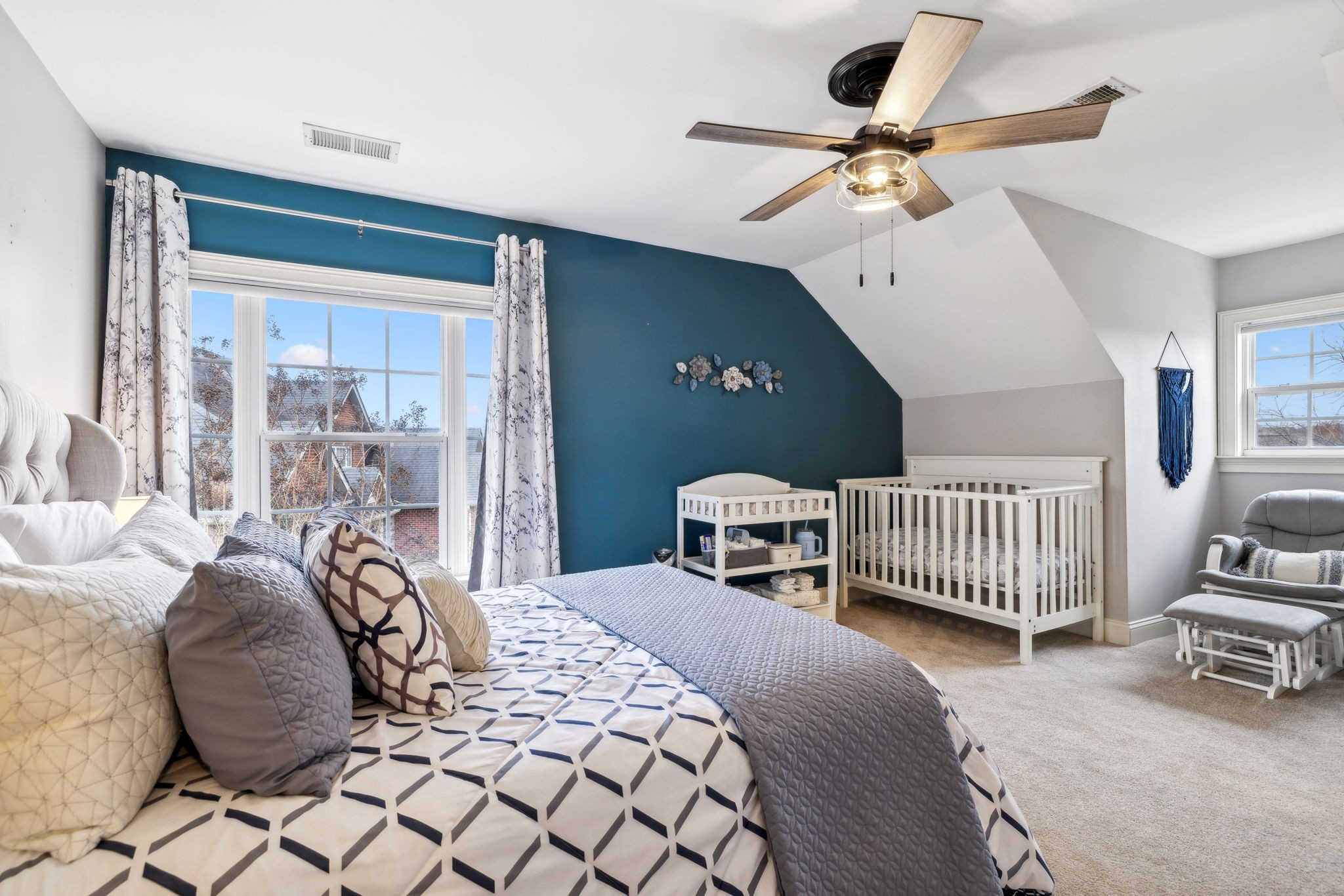 1209 White Rock Road Spring Hill, TN 37174 - Photo 62 of 93 a bedroom with a bed and a chandelier