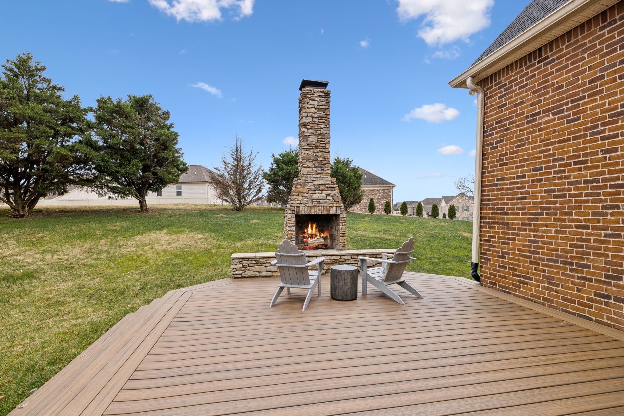 1209 White Rock Road Spring Hill, TN 37174 - Photo 73 of 93 a view of a roof deck with table and chairs and wooden floor