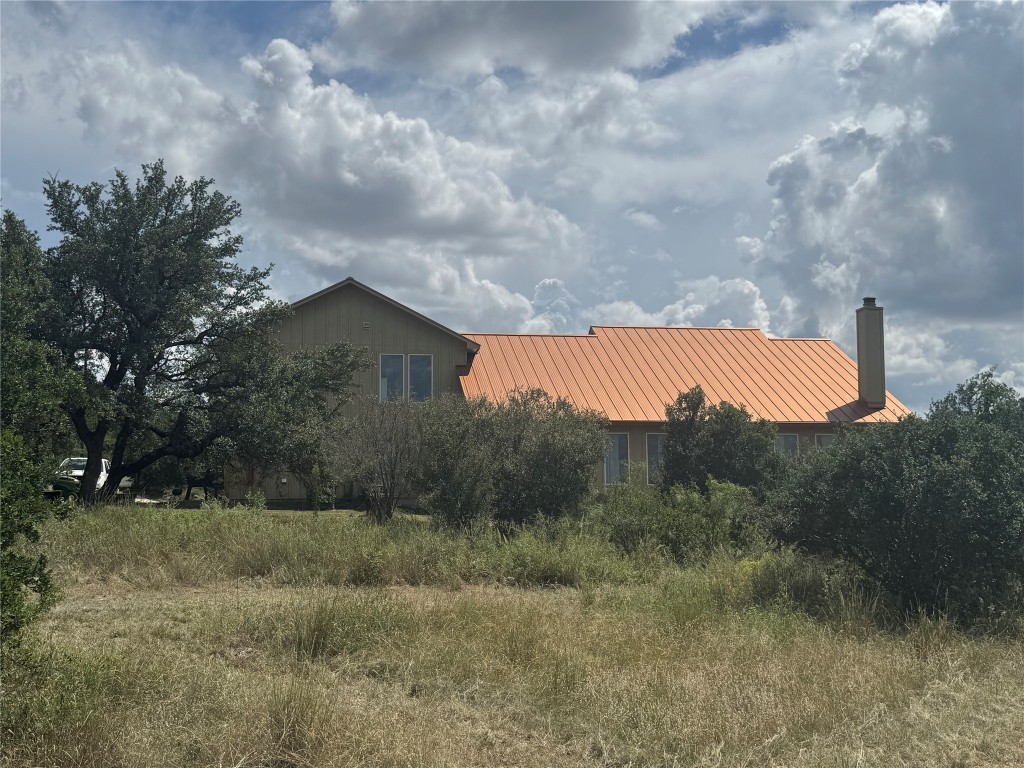 3633 Outback Trail Spicewood, TX 78669 - Photo 14 of 34 a view of a dry yard with green space