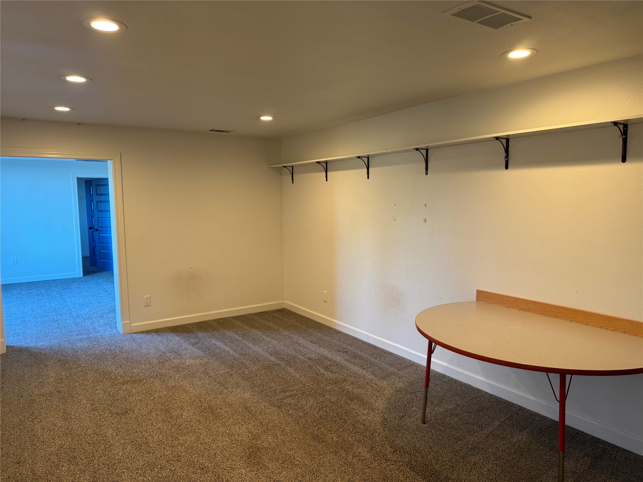 3633 Outback Trail Spicewood, TX 78669 - Photo 24 of 34 Basement with dark carpet and recessed lighting