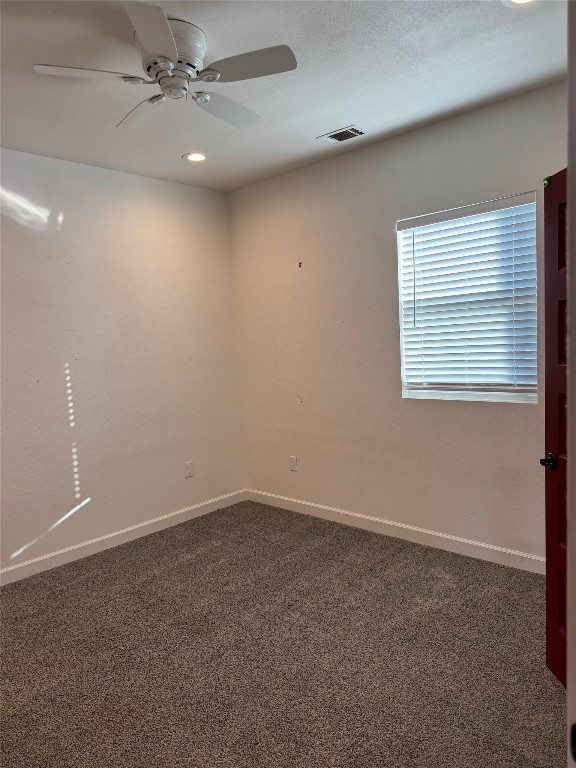 3633 Outback Trail Spicewood, TX 78669 - Photo 25 of 34 an empty room with a window and a fan