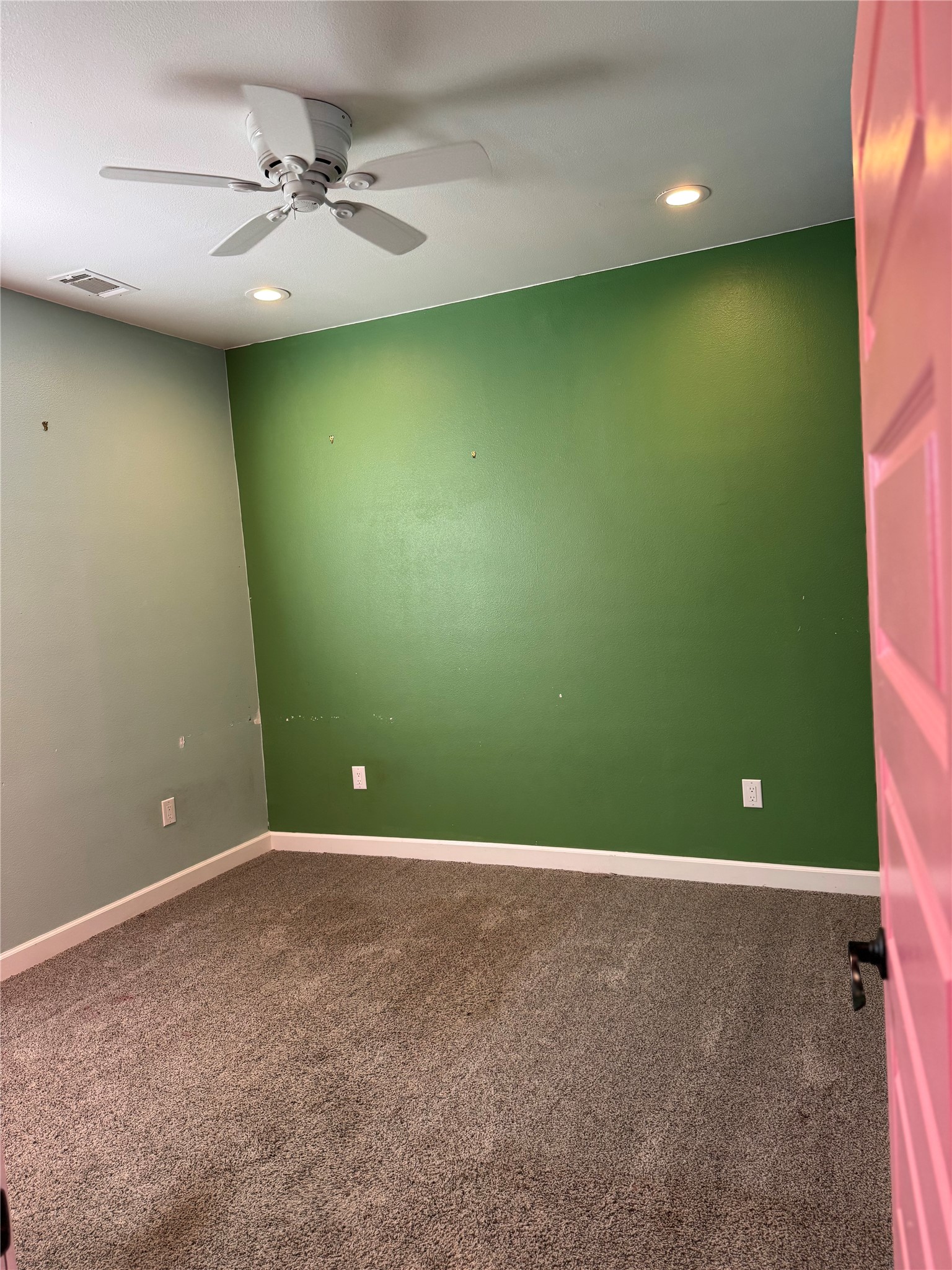 3633 Outback Trail Spicewood, TX 78669 - Photo 26 of 34 Unfurnished room featuring recessed lighting, dark colored carpet, and a ceiling fan