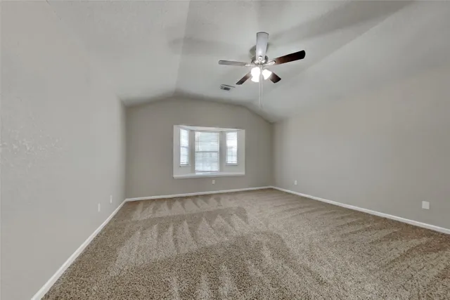 a view of empty room with windows