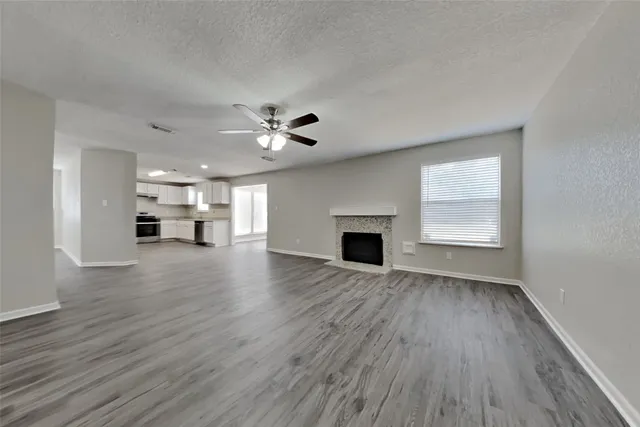 a view of main area with furniture and fireplace