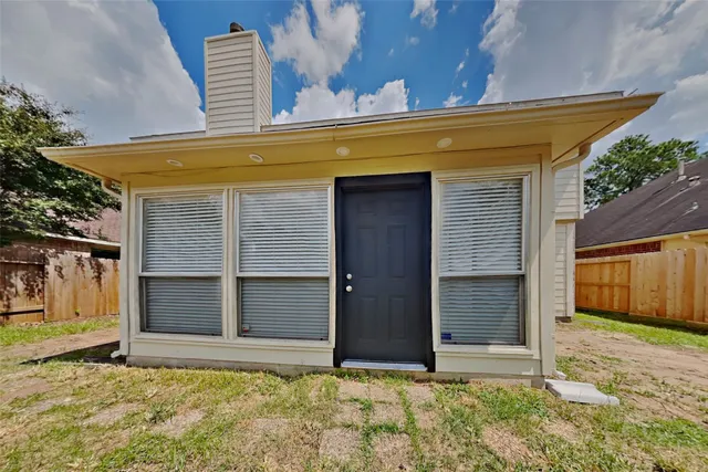 a view of backyard with garage